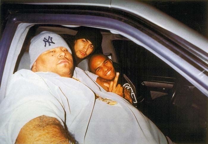 Big Pun taking picture with his boys in car.